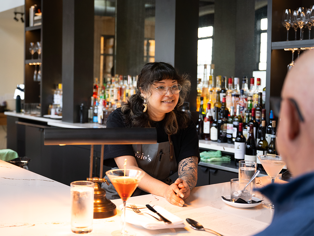Woman waitress serving a customer