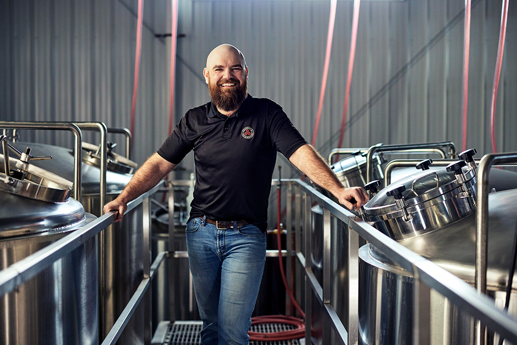 Man standing in a brewery