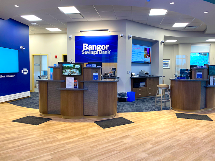 Interior of the Bangor Savings Bank branch on Brighton Avenue in Portland, Maine, showing modern teller pods and customer service area