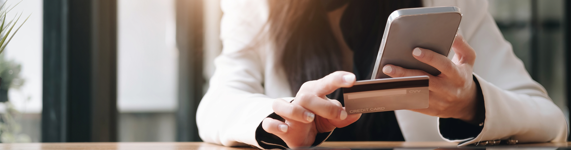 Woman checking her credit card for fraud